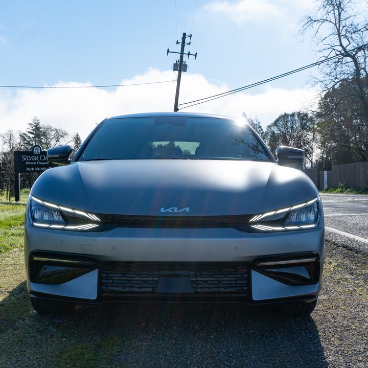 kia EV6 front next to vineyard
