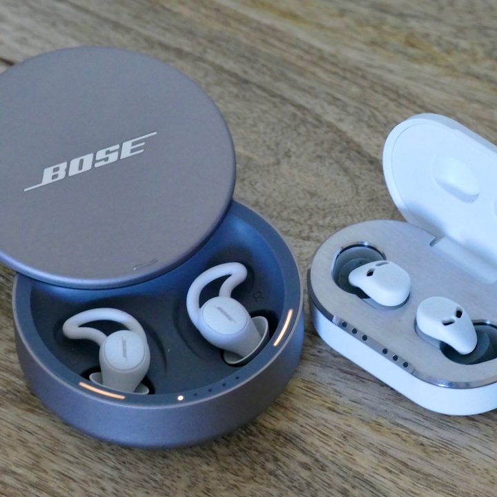 Bose SleepBuds 2 and QuietOn 3 cases with the lids open and the earbuds inside.