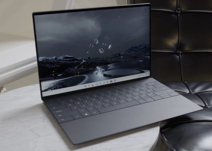 The Dell XPS 13 Plus on a marble side table.