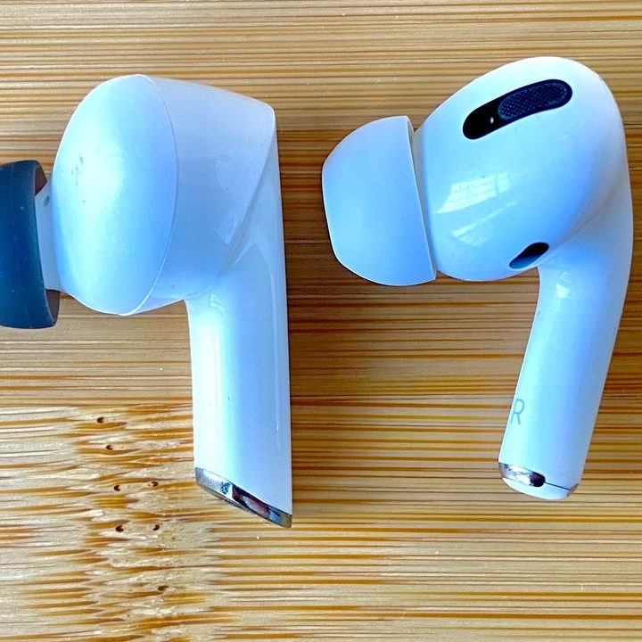 Denon Noise Cancelling Earbuds (left) and Apple AirPods Pro.