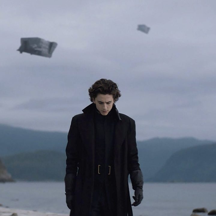 Paul walks with his head down near a lake in the 2021 film Dune.