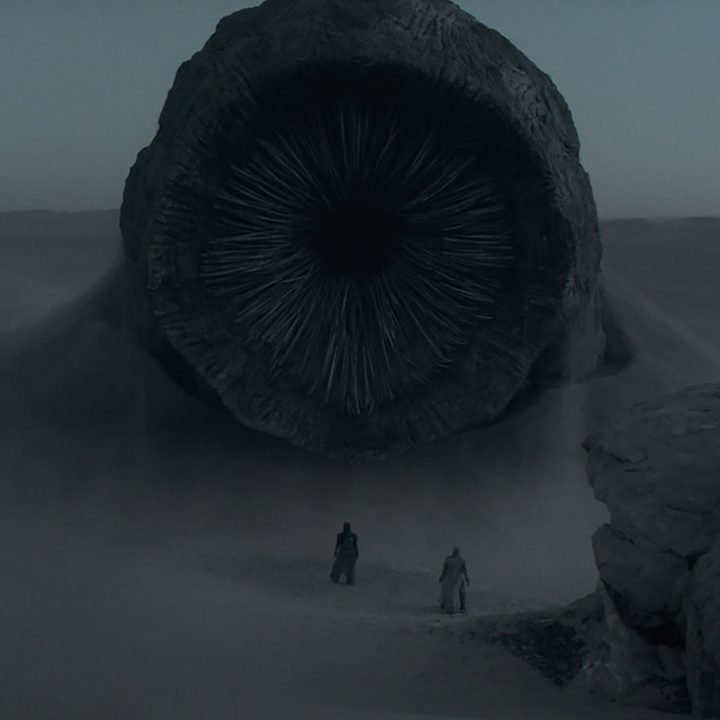 A monstrous sand worm rises from the desert in an early VFX shot from Dune.