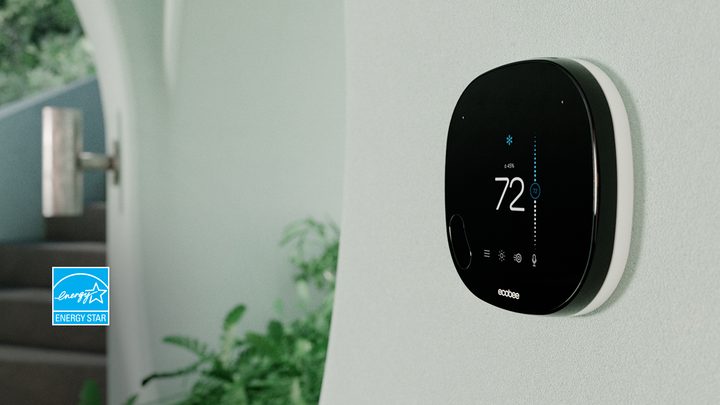 Ecobee thermostat mounted on a wall.