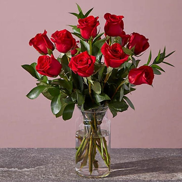 FTD red rose bouquet in a glass vase.