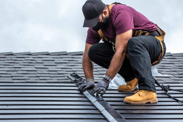 Solar shingles being installed.
