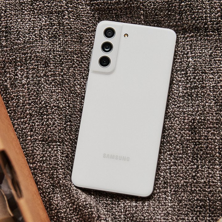 samsung galaxy s21 fe in white on a brown background