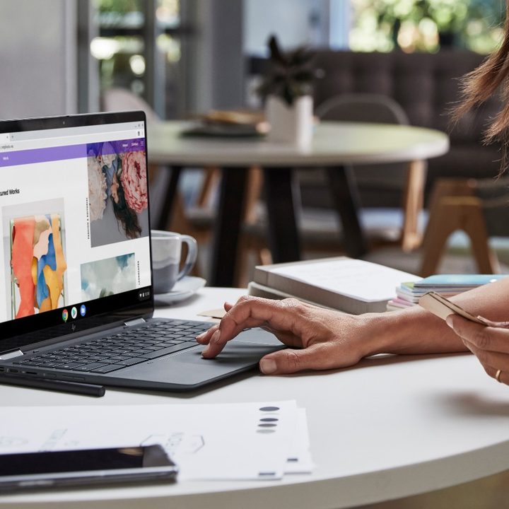 A woman uses the trackpad on an HP Elite Dragonfly Chromebook 3.