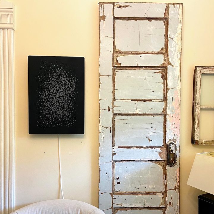 Ikea Symfonisk Picture Frame Speaker hung vertically on a wall.