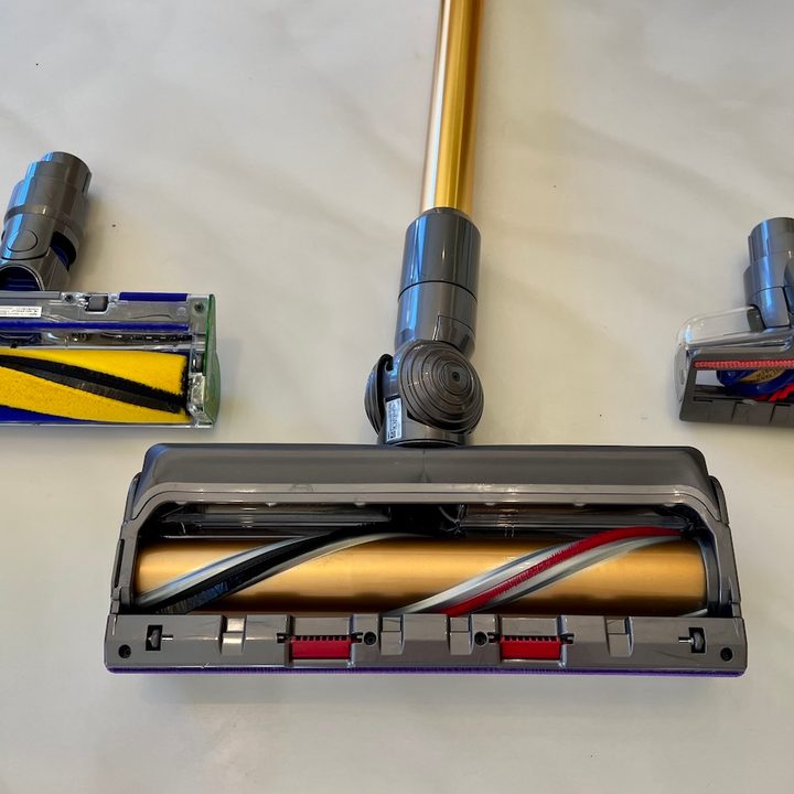 The Dyson Outsize Absolute+ with three attachments of it's many attachments.