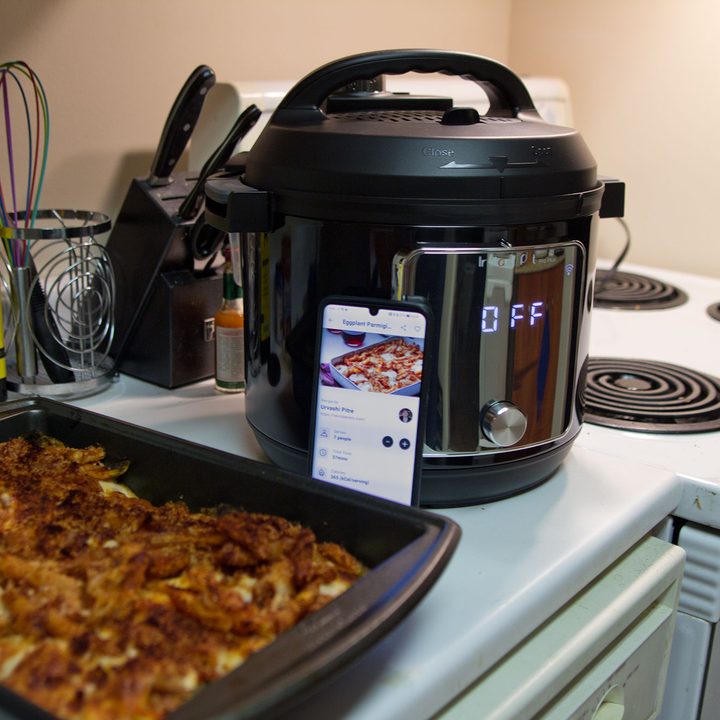 Instant Pot Pro Plus with casserole dish in foreground.