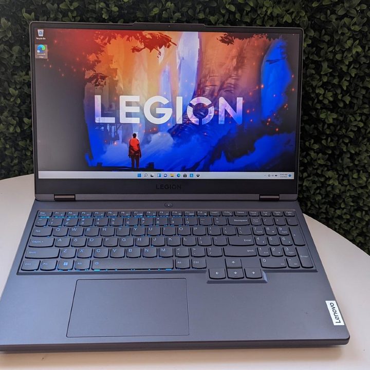 A Lenovo Legion 5 Pro laptop on an outdoor table.
