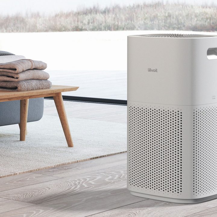 Levoit Core 600 air purifier in living room by window.