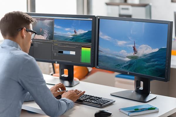 Man working at two monitors.
