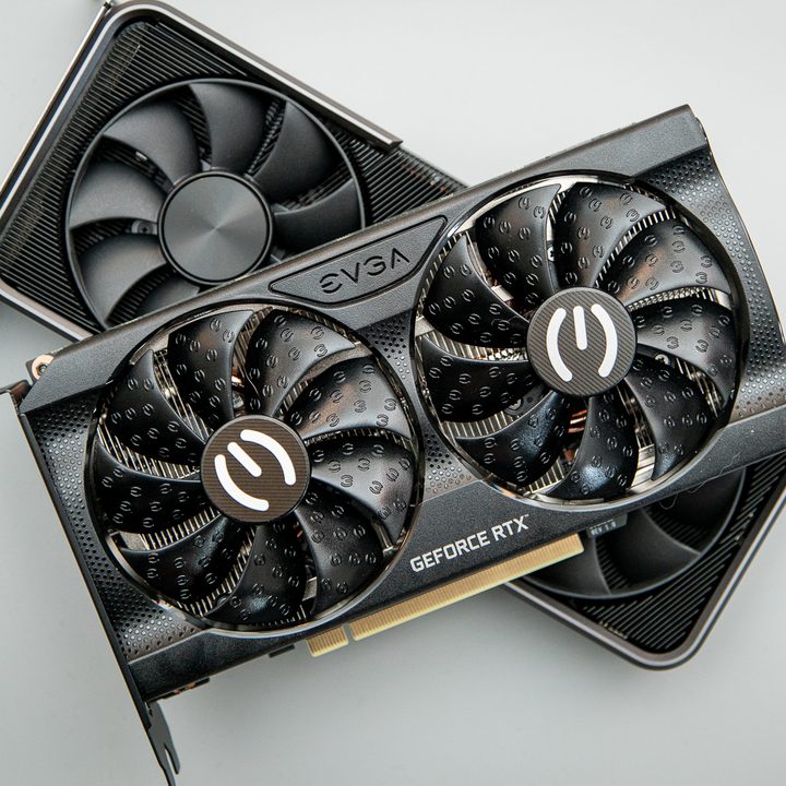 Two graphics cards sitting on top of each other.