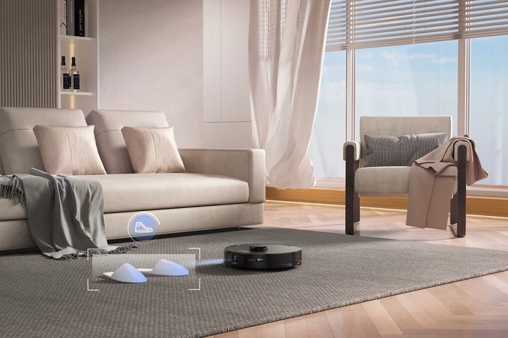 The Roborock S7 MaxV cleaning a living room.