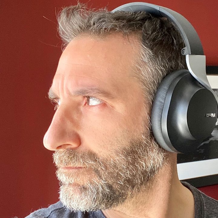 Man wearing Shure Aonic 40 ANC headphones.