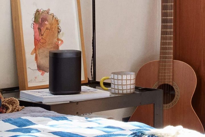 Second gen Sonos One by a bed.
