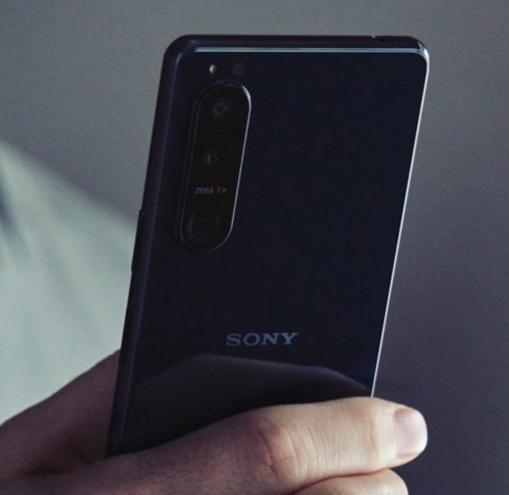 A person holding a Sony phone.