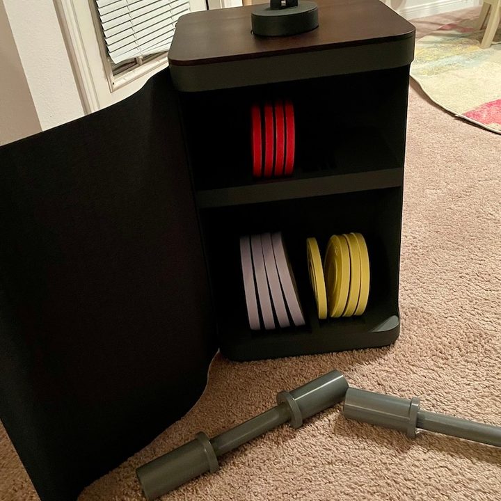 The Tempo Move's cabinet with included weights, dumbbells, and Tempo Core.