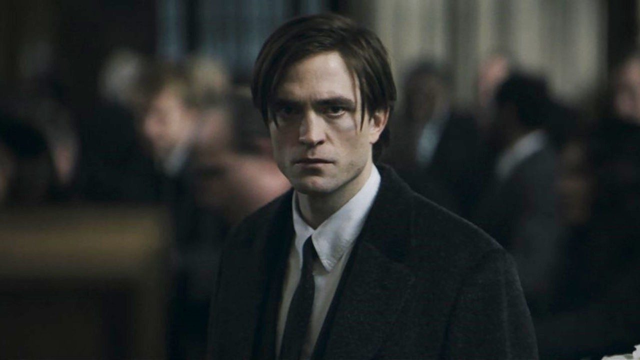 Bruce Wayne looks on stoically in The Batman.