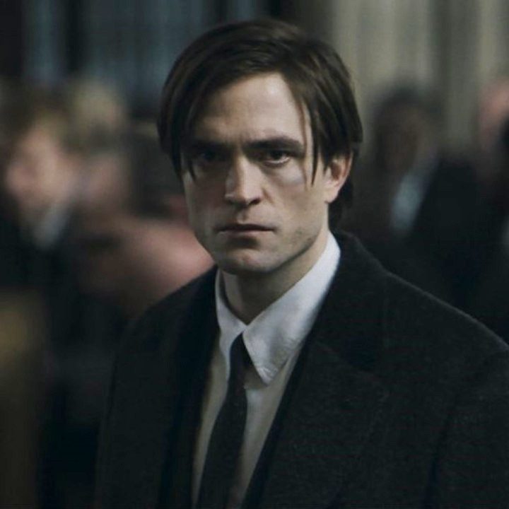 Bruce Wayne (Robert Pattinson) looks on stoically in The Batman.