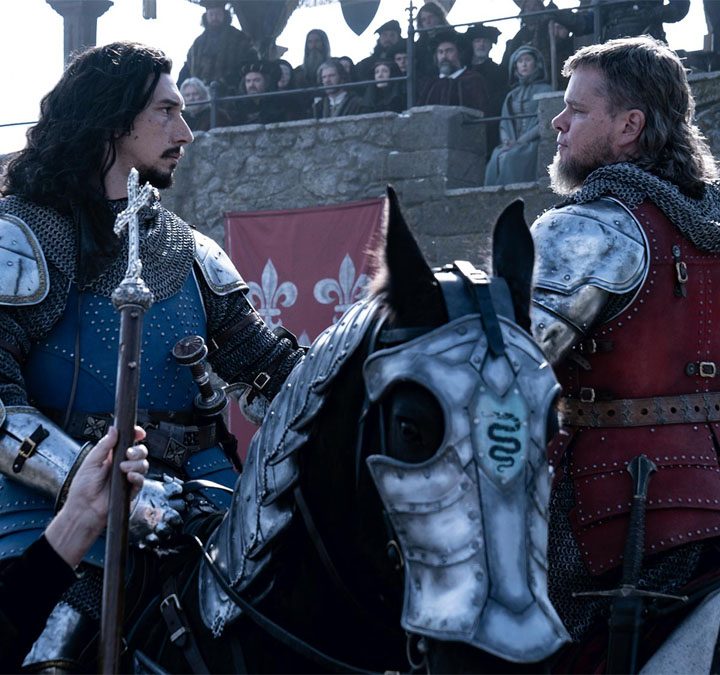 Adam Driver and Matt Damon sit on horses in The Last Duel.