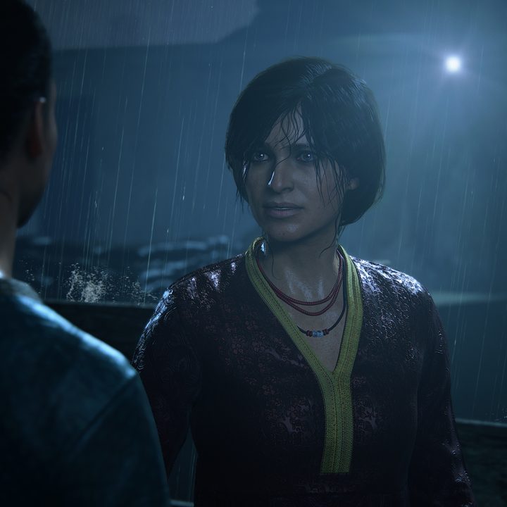 Chloe stands in the rain in Uncharted: The Lost Legacy.