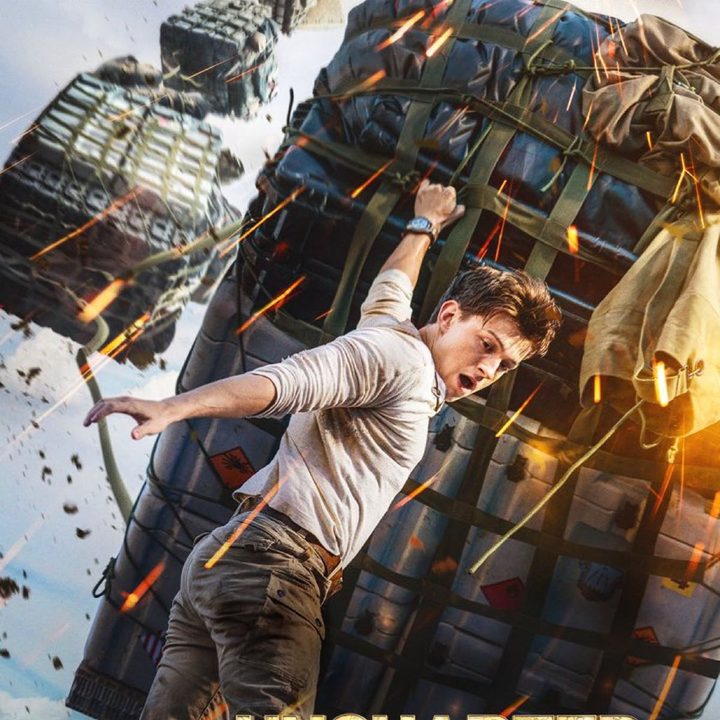 A new poster for Uncharted shows Tom Holland hanging on to cargo falling out of a plane..