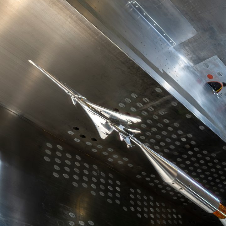 The X-59 small-scale model is seen in NASA Glenn’s 8- by- 6-foot Supersonic Wind Tunnel.