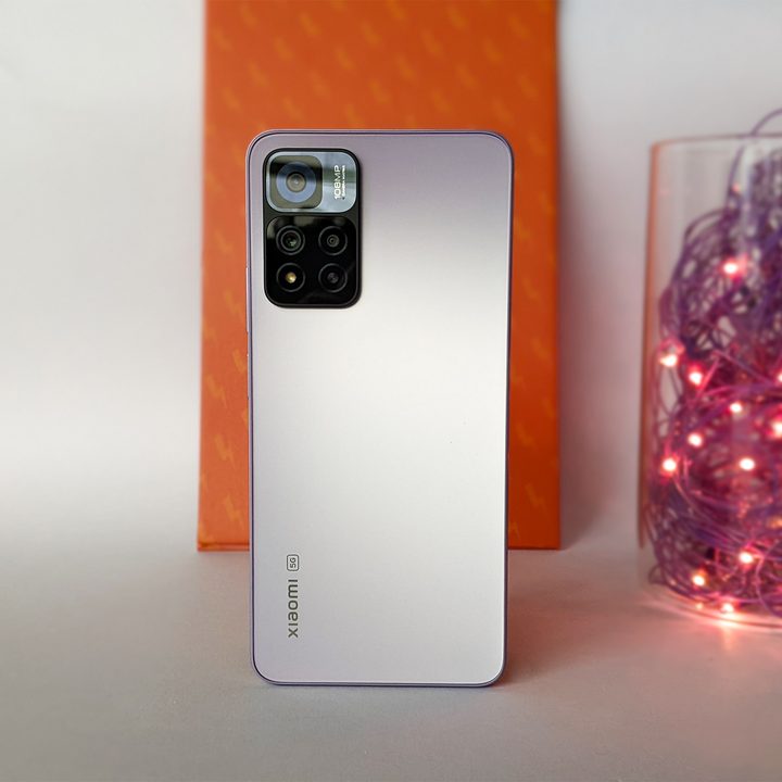 Xiaomi Mi 11i HyperCharge aka Redmi Note 11 Pro China variant in purple color with 120 watt fast charging against orange background with purple twinkle lights.