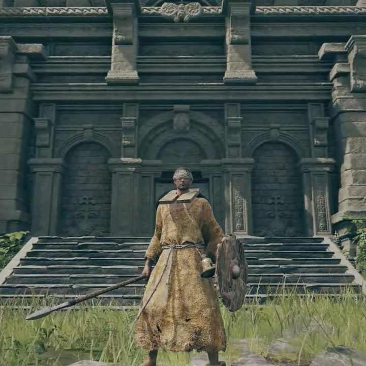 A Prophet adorned in yellow rags in Elden Ring.