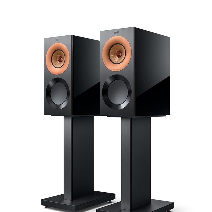 Black and Copper KEF Reference 1 bookshelf speakers on stands.