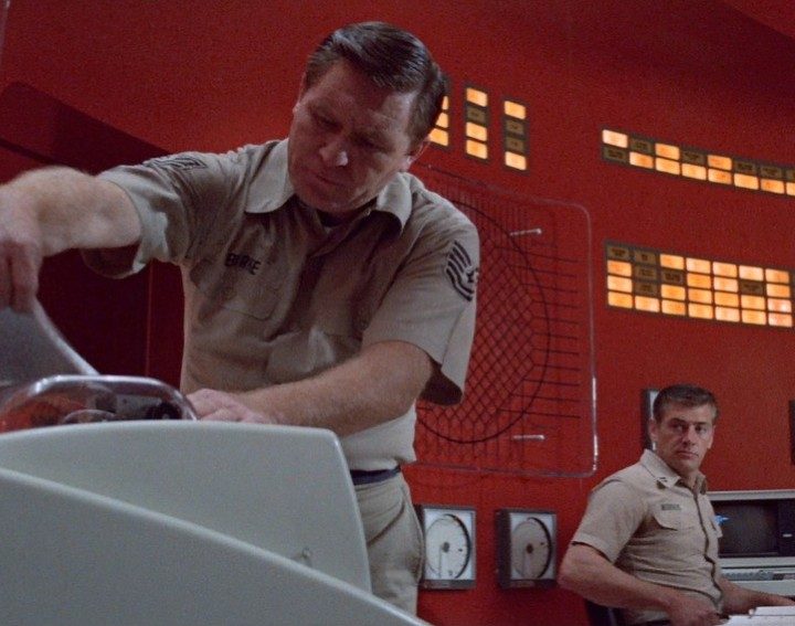 Two men investigate a control room in The Andromeda Strain.
