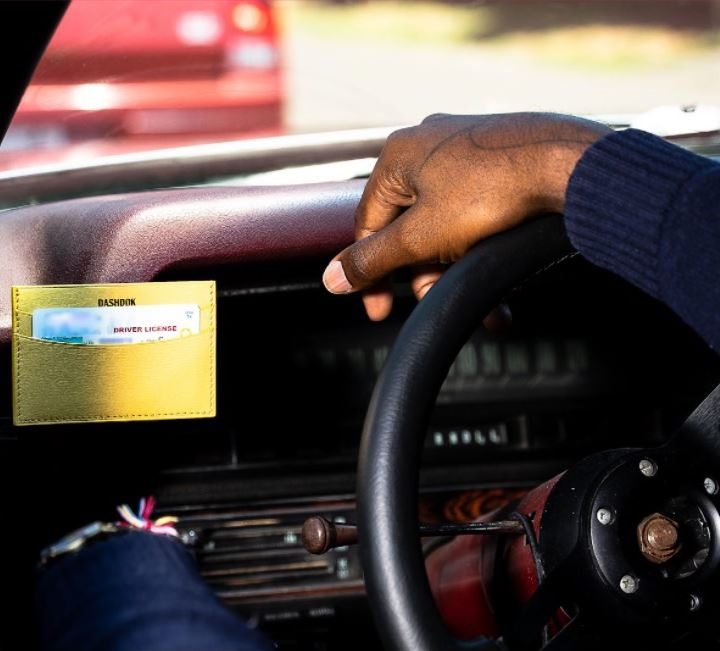 Dashdok wallet on dashboard during traffic stop.