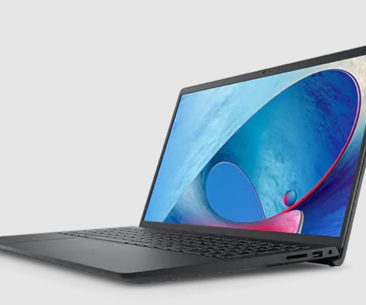 The 15-inch Dell Inspiron 3000 laptop with a blue screensaver.