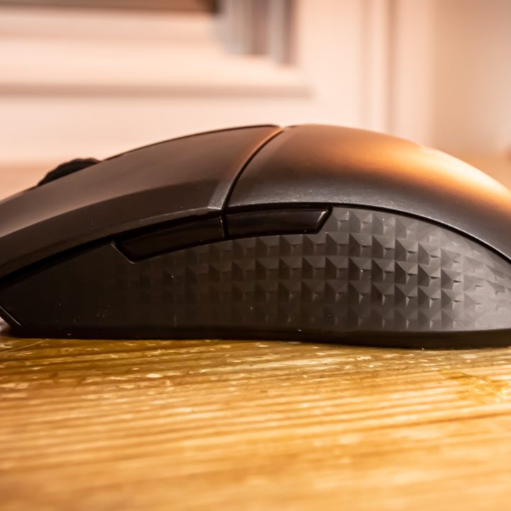 A side view of the MSI Clutch GM41 Lightweight on a wooden table.