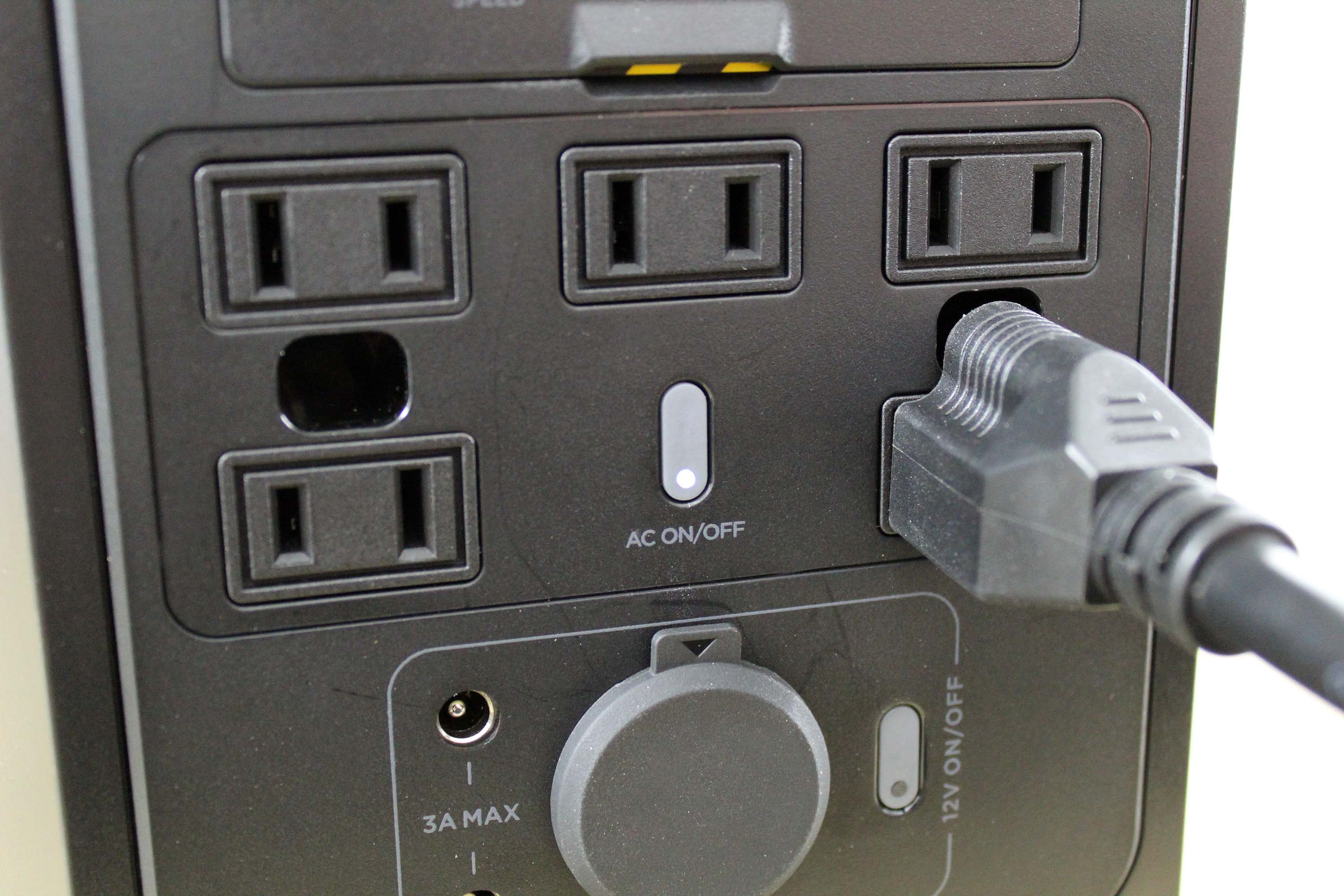A power cord plugged into an EcoFlow Delta Mini.