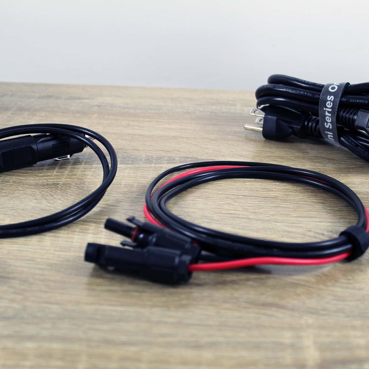 Several EcoFlow River Mini cables on a table.