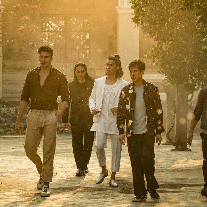 The cast of Fistful of Vengeance walks through a street in Thailand.