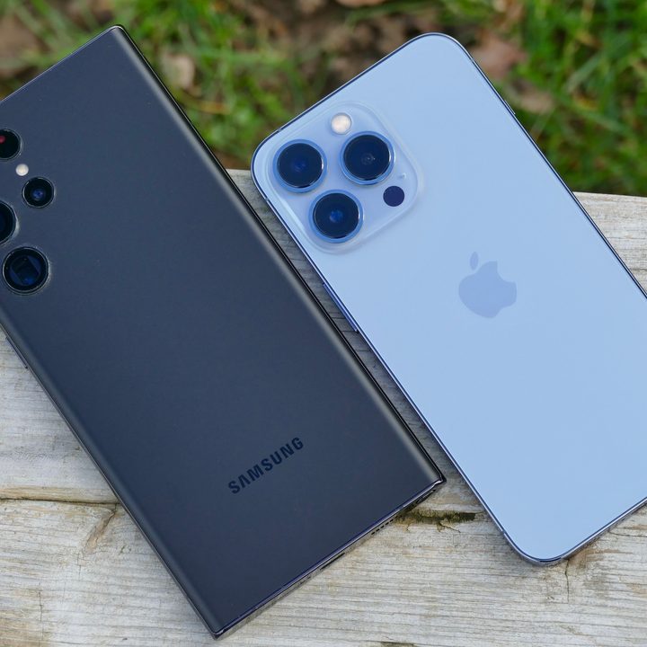 The Samsung Galaxy S22 Ultra and Apple iPhone 13 Pro seen from the back.