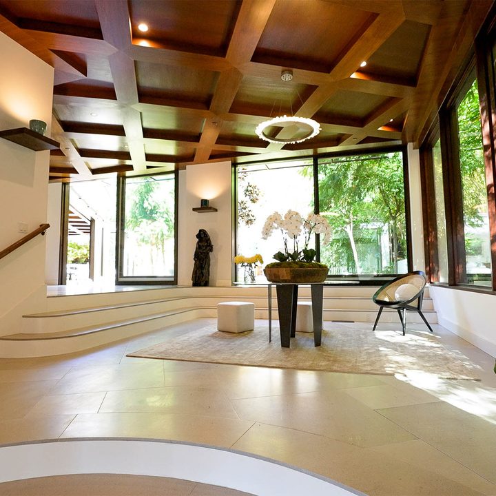 The foyer of a mid-century home with large windows in the Hollywood Hills.