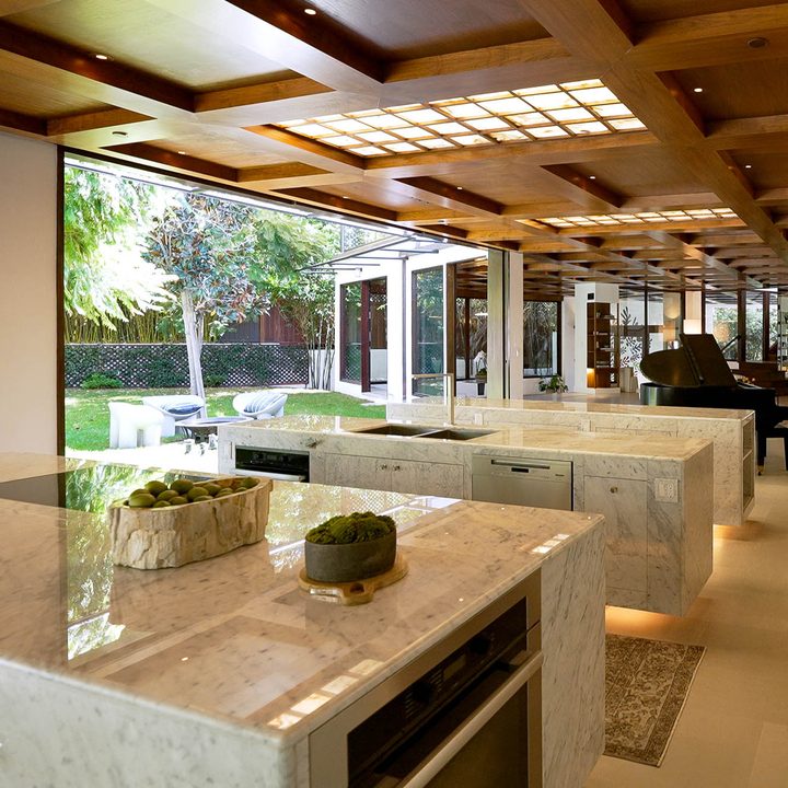 The kitchen of the home profiles in episode 6 of Genius Home features granite countertops and large windows.