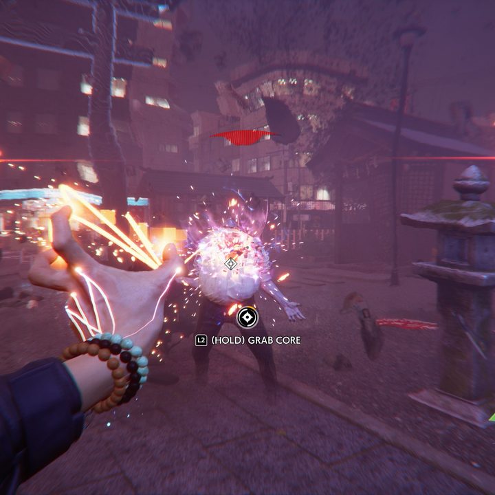 Akito pulls out a spirit's core in Ghostwire: Tokyo.