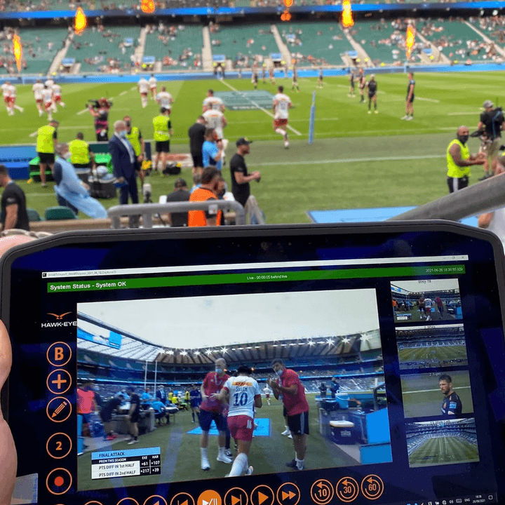 The Hawk-Eye camera replay system being viewed on a tablet from the sidelines of a soccer match.
