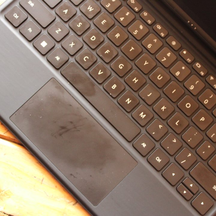 Huawei MateBook E trackpad with finger stains.