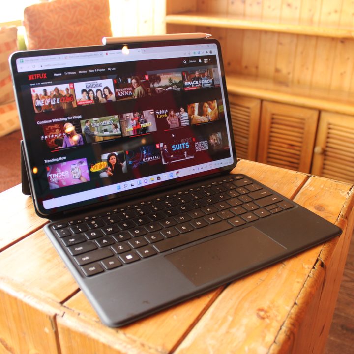 The Huawei MateBook E open on a wooden table.
