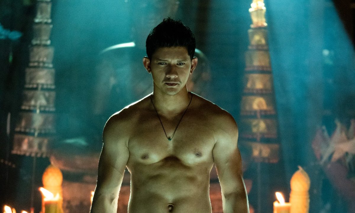 Iko Uwais stands shirtless in a temple in a scene from Fistful of Vengeance.