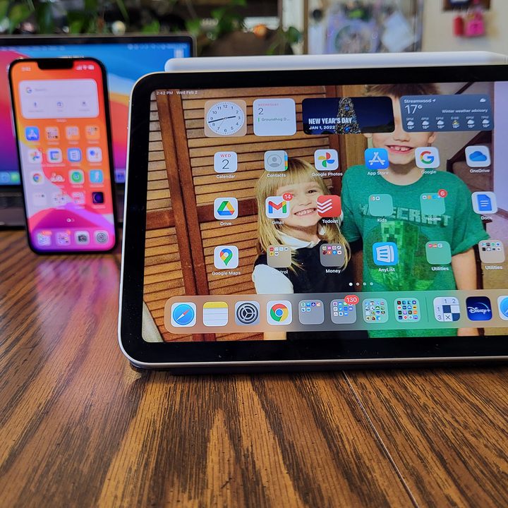 The iPad Mini placed next to an iPhone.