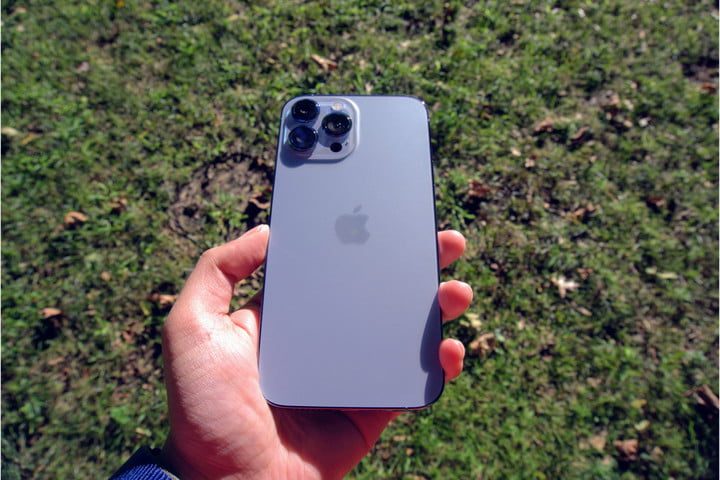 iPhone 13 Pro Max back in hand.
