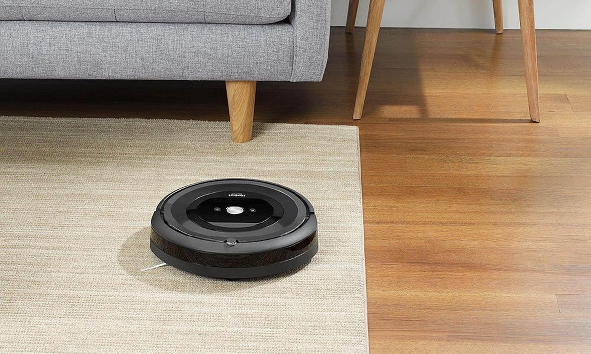 Roomba near a sofa.